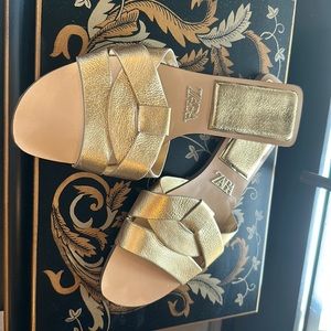 Zara Flat leather sandals with crossed straps at front.